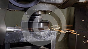 Process of metal grinding on industrial plant, spinning grind disk,