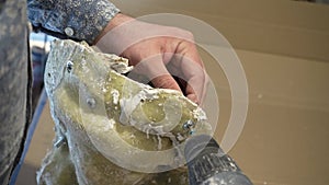 The process of obtaining plaster figures from silicone molds. A factory for the production of home decor.