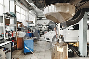 Process of oil change in a car service