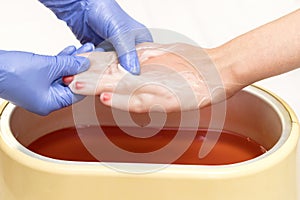 Process paraffin treatment of female hands