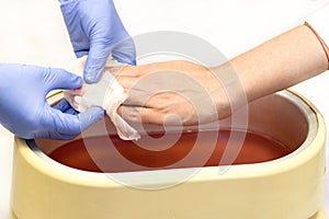 Process paraffin treatment of female hands
