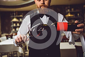 Process of pouring wine into polished glass photo