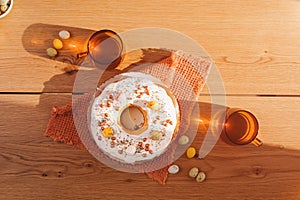 The process of preparing and decorating an Easter cupcake in the kitchen with white cream