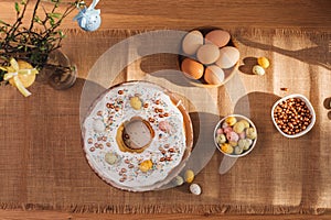 The process of preparing and decorating an Easter cupcake in the kitchen with white cream