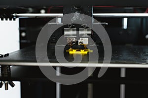 Process of printing physical plastic model on automatic 3d printer machine. Additive technologies, 3D printing and prototyping