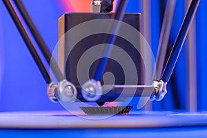 Process of printing plastic model on automatic 3d printer machine - close up