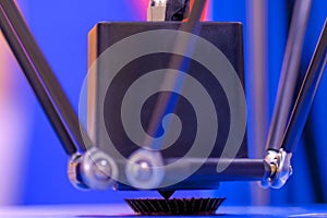 Process of printing plastic model on automatic 3d printer machine - close up