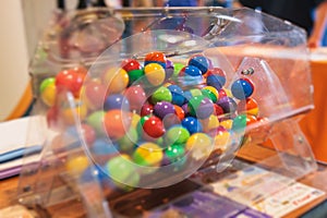 Process of prize drawings, extracting a winning numbers of lottery machine, raffle drum with a bingo balls, bingo machine and