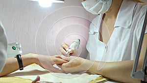 The process of professional manicure.Spa treatments, beauty center, Slow motion