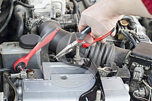 The process of repairing vehicle using pliers