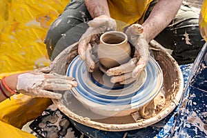 Process of rotation of potter`s wheel, hands of ceramist