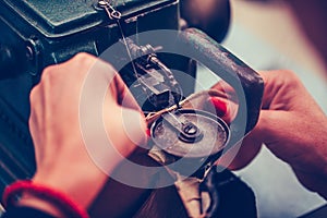 The process of sewing shoes on a sewing machine