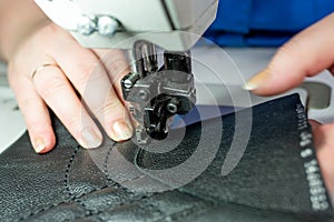 The process of sewing shoes on a sewing machine. Shoe production