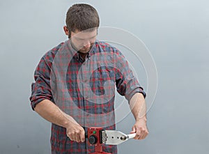 The process of soldering plastic pipes.