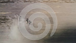 Process of sowing cereals and other crops. Beautiful drone view of a modern tractor working on a huge field