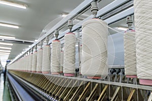 Process of spinning yarn onto spool photo