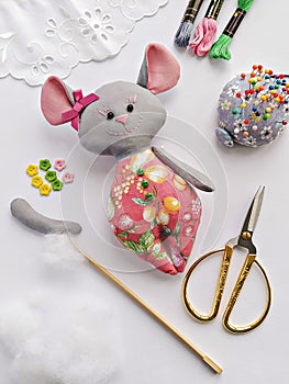 Process of stuffing soft toy stuffed animal textile mouse with synthetic wadding