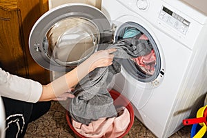 The process of unloading washed clothes from the washing machine