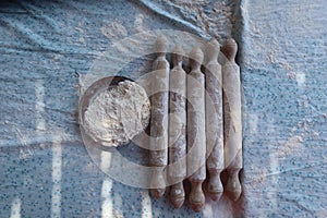 The process of using flour in baking dough to make bread