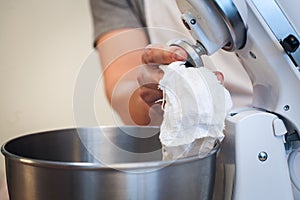 The process of washing mixer, Hands wipe with a rag