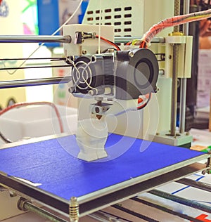 The process of working 3D printer and creating a three-dimensional object