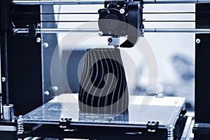 The process of working 3D printer and creating a three-dimensional object