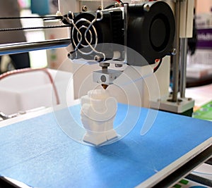 The process of working 3D printer and creating a three-dimensional object