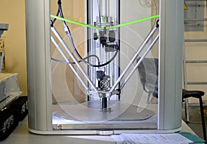 The process of working 3D printer and creating a three-dimensional object