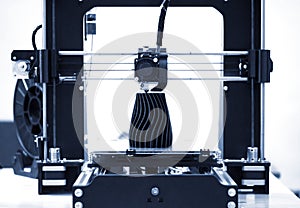 The process of working 3D printer and creating a three-dimensional object