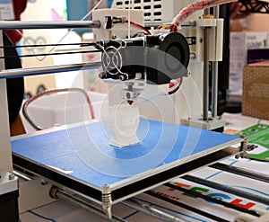 The process of working 3D printer and creating a three-dimensional object