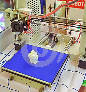 The process of working 3D printer and creating a three-dimensional object