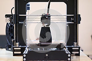 The process of working 3D printer and creating a three-dimensional object