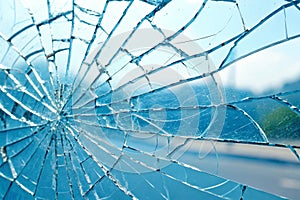 Processed collage of broken blue glass surface texture