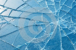 Processed collage of broken blue glass surface texture