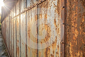 Processed collage of old rusty metal sheet texture in daylight
