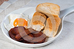 Processed meat with egg and pandesal Filipino bread for breakfast