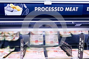 Processed Meat signage at the meat section of supermarket with defocused background