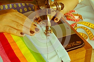 Processes of sewing on the sewing machine sew women`s hands sewi