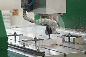 Processing of metal parts with CNC machine at factory with lathes