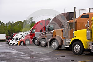 Procession colorful trucks on the truck stop after the rain