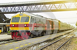 Train led by Diesel Electric locomotives at train Station. photo