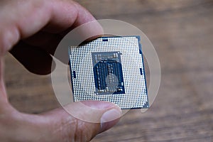 The processor is a desktop computer in hand. Inspect the CPU contacts before installing