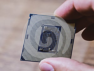 The is a desktop computer in hand. Inspect the CPU contacts before installing