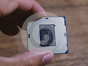 The is a desktop computer in hand. Inspect the CPU contacts before installing