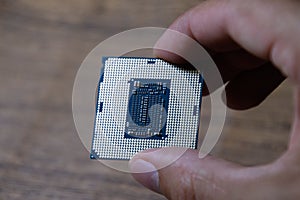 The processor is a desktop computer in hand. Inspect the CPU contacts before installing