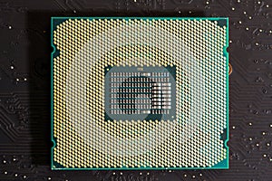 Processor on motherboard hardware. Circuit board in close-up macro with processor chip. Circuit board for computing technology
