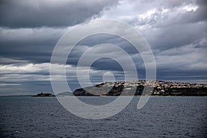 Procida Island on a rainy day with dramatic clouds