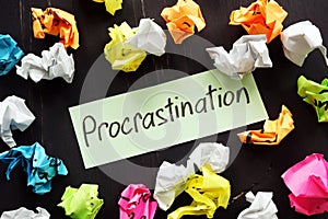 Procrastination sign and  paper balls