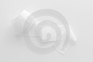 Proctology concept with toilet paper on white background top view