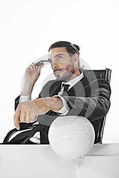 Procurator business man bets on a football match in office